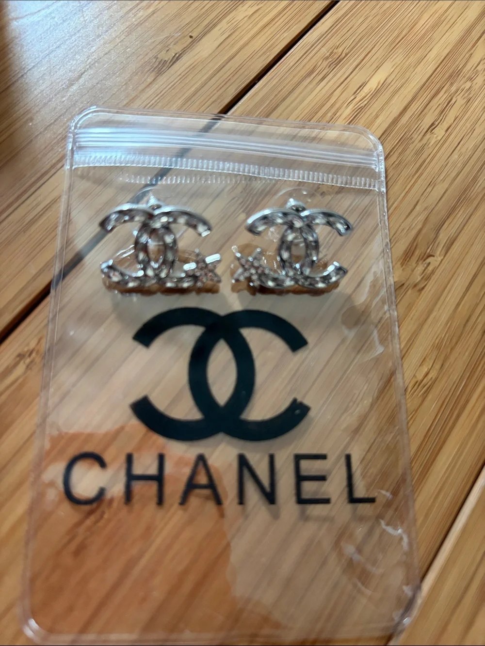 CHANEL Silver Interlocking CC Crystal Stud Earrings